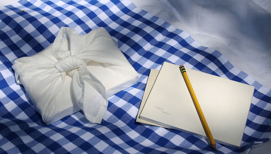 Greeting cards and stationery wrapped in a linen cloth