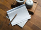  YS Notes multipage card (English-version) and pencil on wood desk